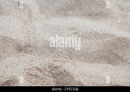 Sand background. Uneven gray sand close up. Stock Photo