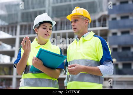 Two qualified engineers are discussing a construction plan Stock Photo