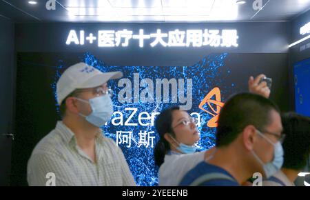 SHANGHAI, CHINA - JULY 10, 2021 - Visitors visit the AI iLab scene displayed at the Astrazeneca stand at the 2021 WAIC in Shanghai, China, July 10, 20 Stock Photo