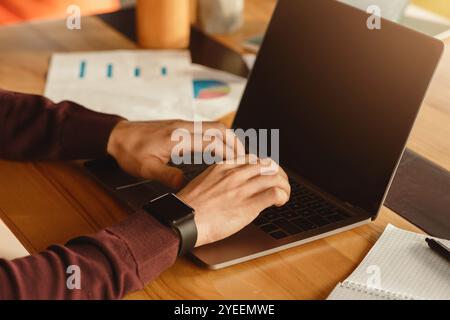 Male Hands Working On Laptop Typing At Workplace In Office Stock Photo