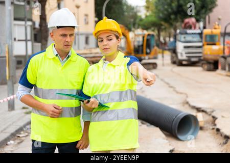 Two qualified engineers are discussing a construction plan Stock Photo