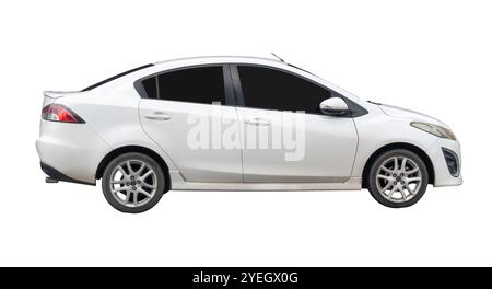 Side view of white sedan car is isolated on white background with clipping path. Stock Photo