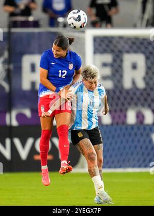 United States defender Emily Sams (2) dribbles past Australia forward ...