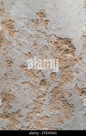 Close-up view of the wall paint peeling off and mold on the wall. Stock Photo