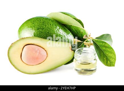 Avocados with leaves and natural avocado oil isolated on white Stock Photo
