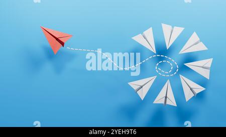 A group of blue paper planes and one is sailing away in the opposite direction, the concept of individuality, breaking free from influence.3D renderin Stock Photo