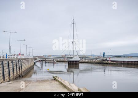 Slipway at Rhyl harbour towards the Dragon Bridge on the Denbigshire coast on North Wales. Stock Photo