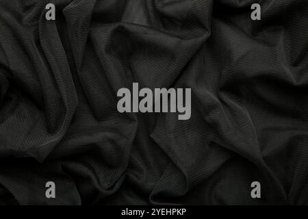 Black linen fabric texture. Black cloth textile background. Draped raw organic cloth black pattern, banner. Top view Stock Photo