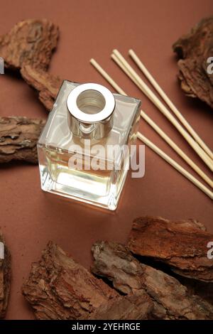 Home perfume reed diffuser with wood. Vertical photo. Stock Photo