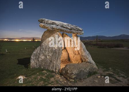 Prehistoric megalithic dolmen at night in the north of Spain, starry night in the background Stock Photo