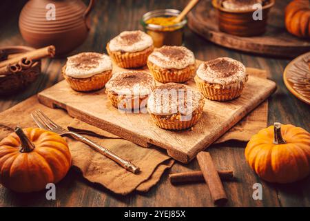 Homemade pumpkin muffins with cheesecake icing Stock Photo