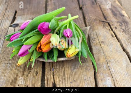 colourful tulips on wooden background Stock Photo