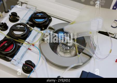 Viewing detailed laboratory setup with scientific equipment designed for analyzing samples, featuring intricate tubes and wires showcasing precision technology used in research Stock Photo