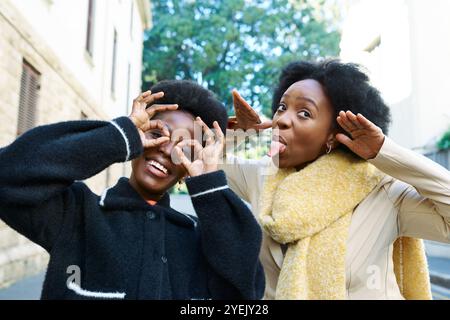 Cheerful Friends Making Funny Faces While Enjoying a Day Out in the City Together Stock Photo