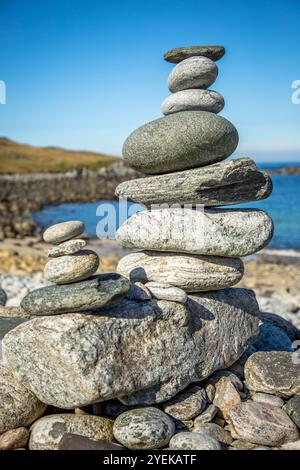 Pebble stack balanced on the sea shore Stock Photo