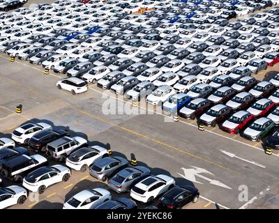 LIANYUNGANG, CHINA - OCTOBER 31, 2024 - A large number of vehicles are gathered for loading at the terminal of Oriental Port Branch in Lianyungang Por Stock Photo