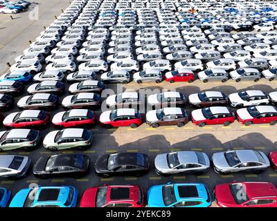 LIANYUNGANG, CHINA - OCTOBER 31, 2024 - A large number of vehicles are gathered for loading at the terminal of Oriental Port Branch in Lianyungang Por Stock Photo