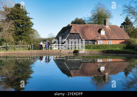 Visitors enjoying the grounds of Bateman's, the former home of Rudyard Kipling on a sunny day in Autumn Stock Photo