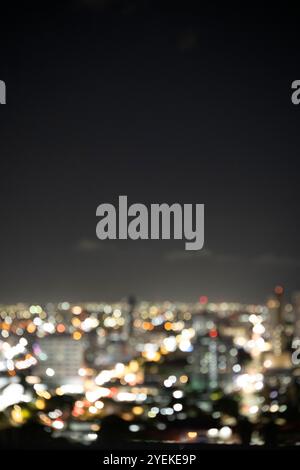 Blurred city night lights creating a background. Stock Photo