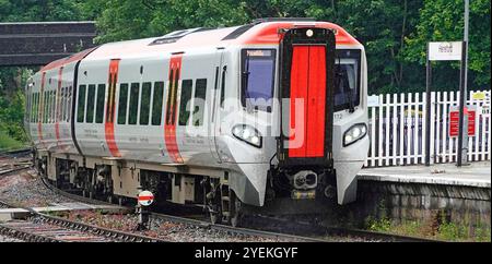 Close up Transport for Wales Rail Class 197 passenger train about to stop at historical Hereford station Welsh Marches Line Herefordshire England UK Stock Photo