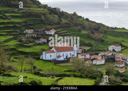 Breathtaking view of the houses on the cliff at Atlantic ocean coast in Azores islands Portugal Stock Photo