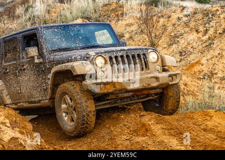 Off-road vehicles, driving in mud, overcoming off-road obstacles in a four-wheel drive car Stock Photo
