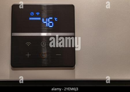 Electronic panel for setting the temperature in the water heater furnace Stock Photo