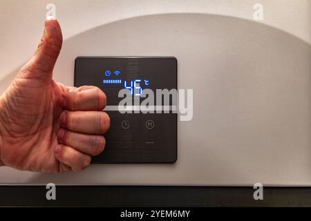 Electronic panel for setting the temperature in the water heater furnace Stock Photo