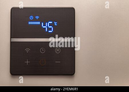 Electronic panel for setting the temperature in the water heater furnace Stock Photo
