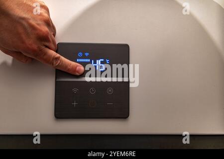 Electronic panel for setting the temperature in the water heater furnace Stock Photo