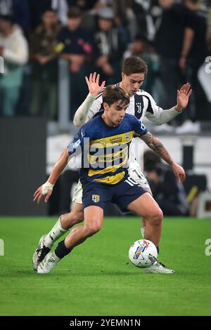 Turin, Italy. 30th Oct, 2024. Adrian Bernabe of Parma Calcio shields the ball from Kenan Yildiz of Juventus during the Serie A match at Allianz Stadium, Turin. Picture credit should read: Jonathan Moscrop/Sportimage Credit: Sportimage Ltd/Alamy Live News Stock Photo