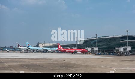 View at Tan Son Nhat International Airport in Ho Chi Minh City, Vietnam largest city. Airlines preparing to take off from Tan Son Nhat International A Stock Photo