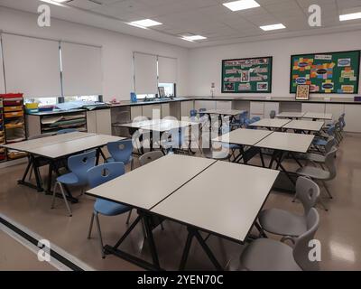 Empty classroom with chairs and tables in campus. Daycare center without children and teacher Stock Photo