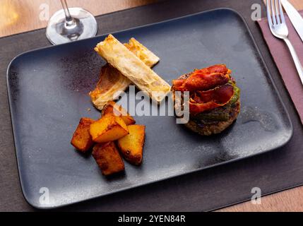 Hamburger with cutlet, pepper, ham, potatoes and white bread Stock Photo