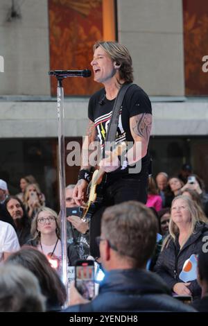 NEW YORK, NEW YORK - OCTOBER 30: Country music star Keith Urban performs live during NBC's 'Today' show in Midtown on October 30, 2024, in New York City. Fans gathered early to catch the electrifying performance as Urban rocked the crowd with his signature hits at Rockefeller Plaza. (Photo: Giada Papini Rampelotto/EuropaNewswire) Stock Photo