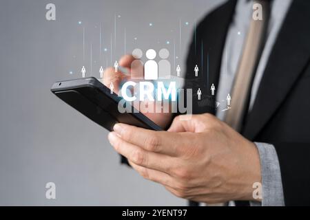 CRM Customer Relationship Management concept, Businessman using CRM software for business marketing, Customer management. Targeting customer. Data exc Stock Photo