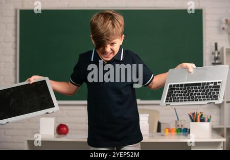 Bad boy student vs distance education. Angry kid broken online laptop ...