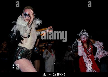 New York, United States. 31st Oct, 2024. Costumed parade goers dance during the 51st Annual Village Halloween Parade in New York, NY, on October 31, 2024. (Photo by Erin Lefevre/NurPhoto) Credit: NurPhoto SRL/Alamy Live News Stock Photo