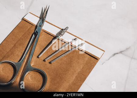 Clean manicure instruments. Manicure set in paper heat dry bag for sterilization. Sterilization of instruments healthcare concept. Copy space Stock Photo