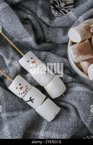 Two happy funny marshmallow snowmen. Marshmallow friends. Diy. Sweet treat for kids funny marshmallow snowman. Christmas winter holiday decoration. Ne Stock Photo