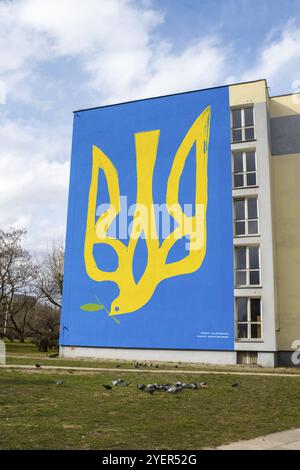 Gdansk Poland March 2022 UKRAINE national emblem with pigeon symbol of peace IN GRAFFITI. Mural painted in building house Poland Gdansk Europe to show Stock Photo