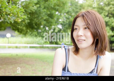Woman sitting on chair Stock Photo