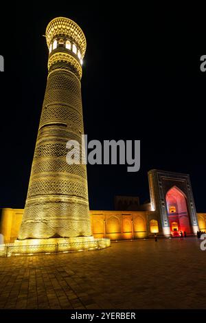 Night view of  Kalyan Minaret in the holy Bukhara. Kalyan Mosque, composing Poi-Kalyan Ensemble is the central mosque of holy Bukhara. Uzbekistan. Kal Stock Photo