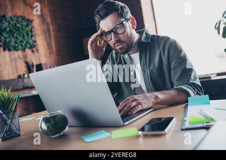 Photo of busy serious boss wear shirt working modern device indoors workplace workstation Stock Photo