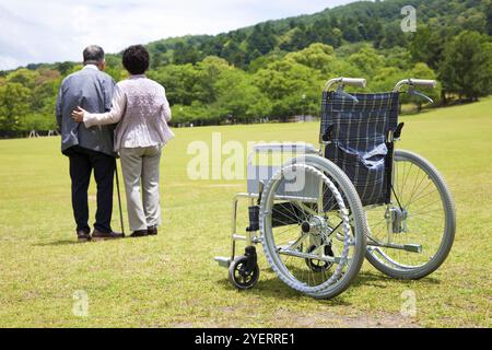 Wheelchair and couple Stock Photo