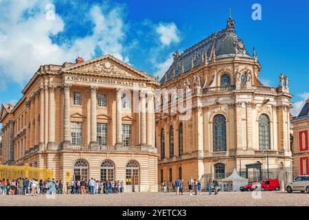 VERSAILLES, FRANCE - JULY 02, 2016 : Head (main) entrance with  the people (tourists) and  Famous Royal Chapel. Versailles, France. Stock Photo