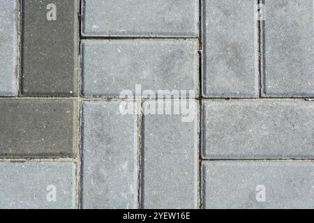 Gray concrete paving slabs. Pattern and Texture of gray paving slabs. Top view. Stock Photo