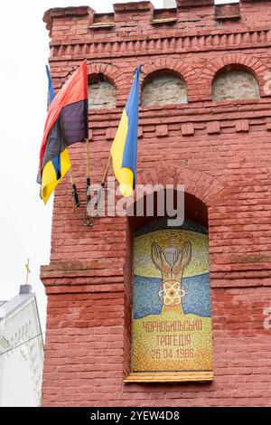 Chernobyl tragedy. The inscription is in Ukrainian. Mosaic on the wall of the building. Multicolored tiles. Ukrainian house flag. Ukraine, Truskavets - August 10, 2024 Stock Photo