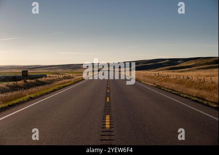 Sunrise highway in the badlands of Southern Alberta. Stock Photo