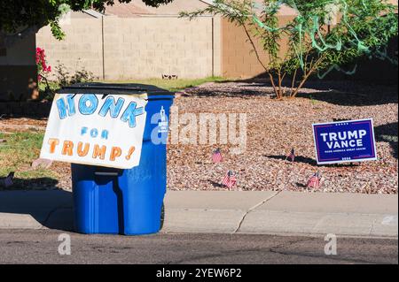 Apache Junction, Arizona, USA. 31st Oct, 2024. A 'Honk for Trump! sign on a residential trash can near a ''Trump-Vance Make America Great Again!'' poster reflects voter responses to recent campaign controversies. (Credit Image: © Eduardo Barraza/ZUMA Press Wire) EDITORIAL USAGE ONLY! Not for Commercial USAGE! Stock Photo